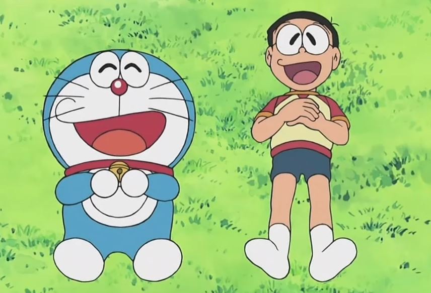 Doraemon và Nobita cười sảng khoái trên bãi cỏ