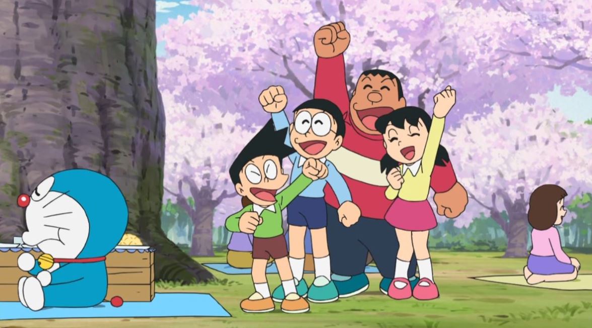 Doraemon ngồi ăn, cả nhóm hò reo dưới hoa