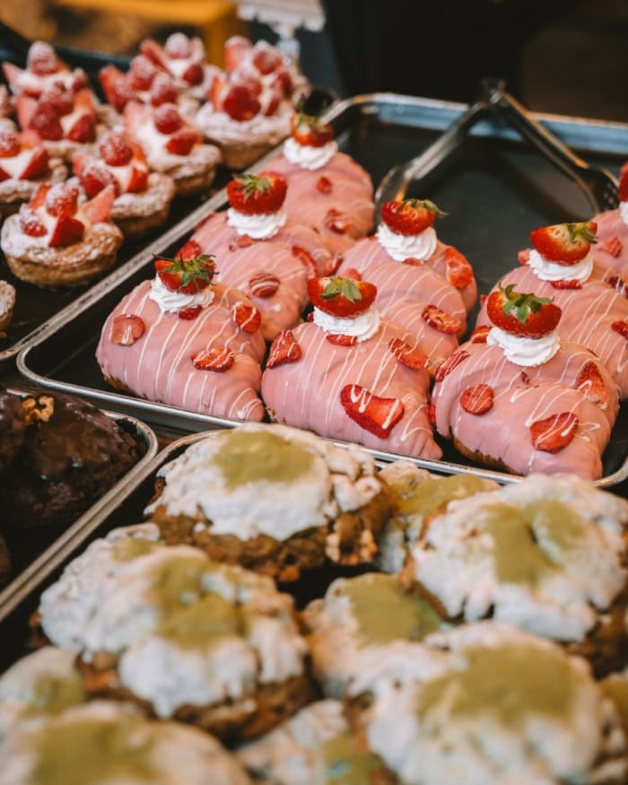 Korean pastries with intricate strawberry and matcha decorations