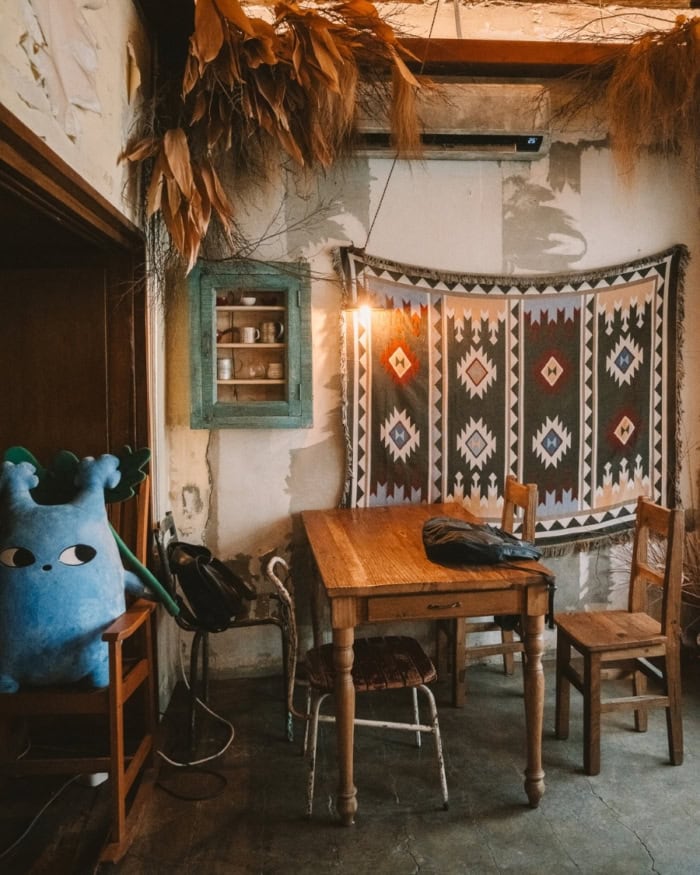 Cozy Korean-style café with patterned wall hangings