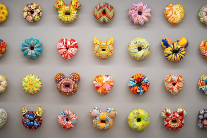 Cute animal-shaped and round donuts in an art gallery