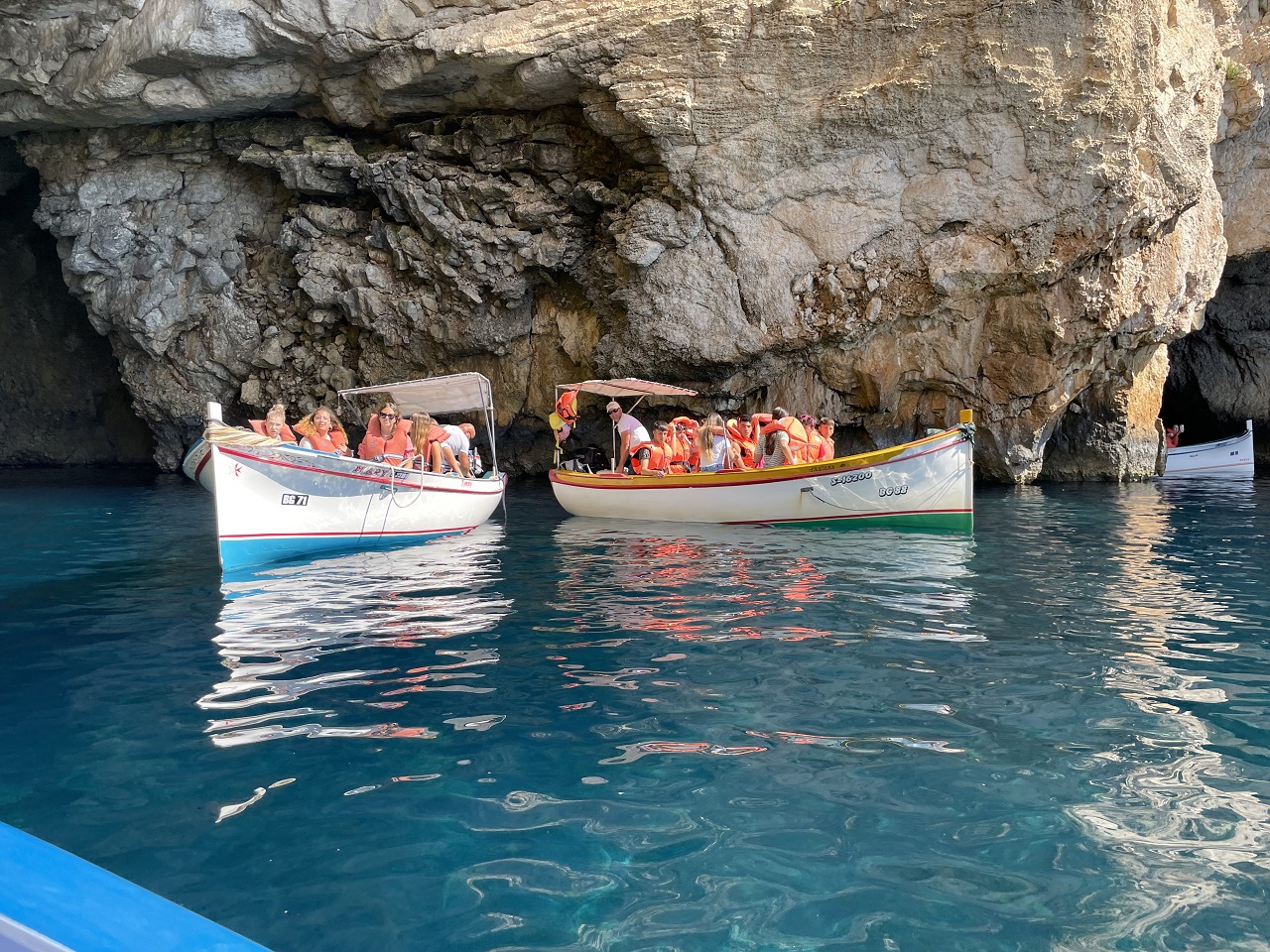 Coastal Malta inside a cave with clear blue turquoise water