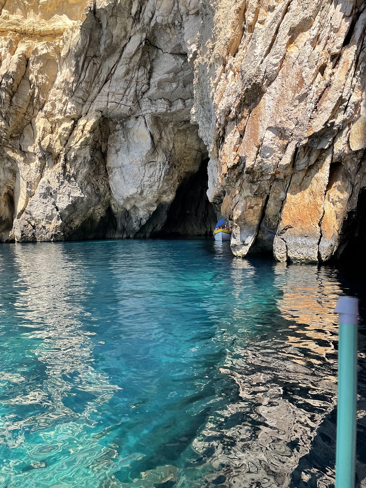 Coastal Malta inside a cave with clear blue turquoise water