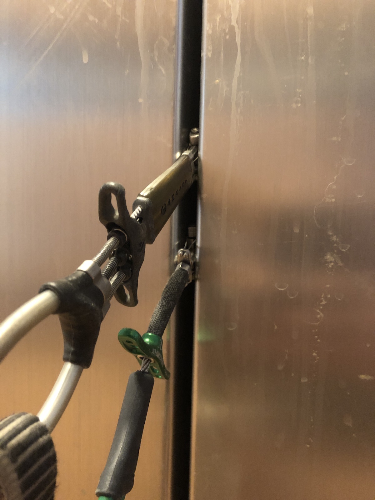 This photo shows how the smallest DMM Dragonfly (the green unit on the bottom) compares to the smallest Black Diamond C3 compare when placed in between the doors of the author