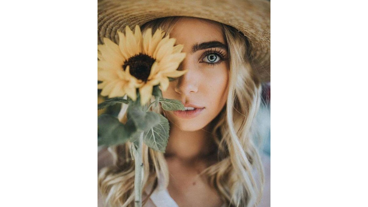 Cách chụp ảnh với hoa hướng dương che mặt